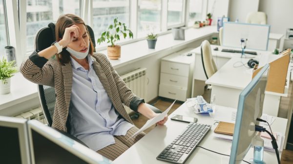 Frustrated woman in empty office