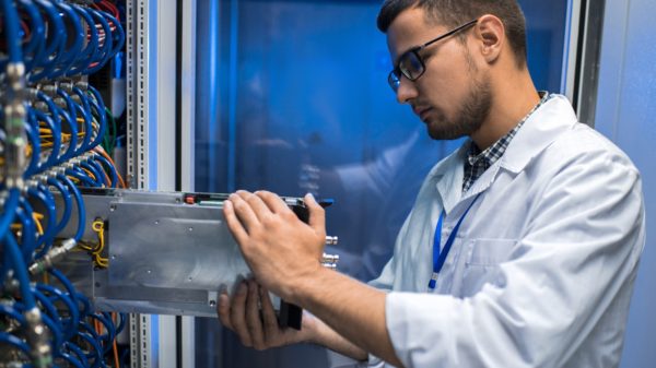 IT Scientist Working with Supercomputer