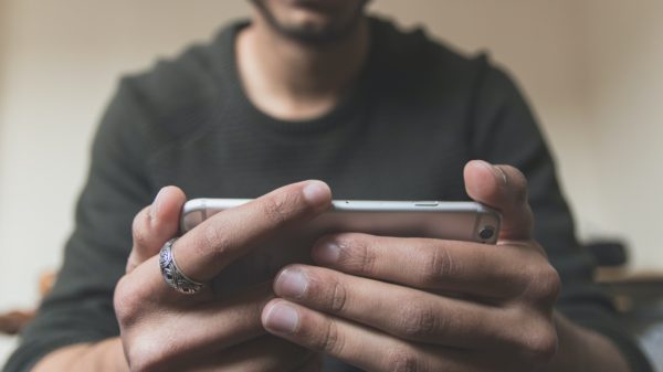 Man watching video on a smartphone.