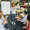 Woman team leader making presentation for colleagues