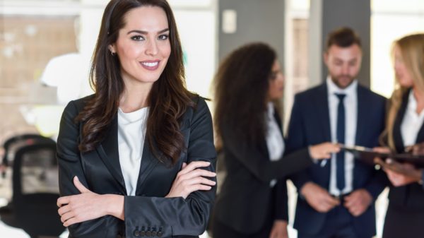 Businesswoman leader in modern office with businesspeople workin