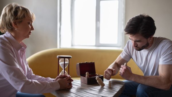 Mental health therapist watching patient showing aggression