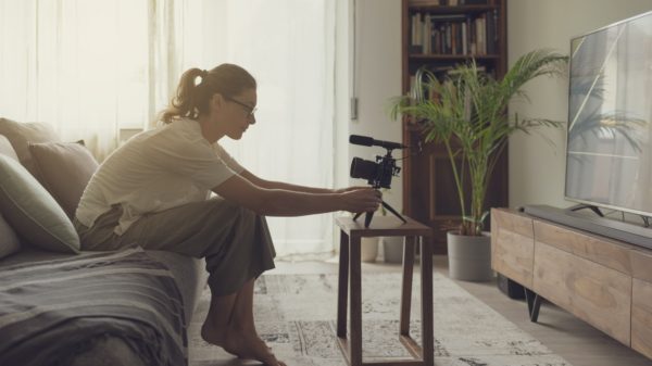 Youtuber recording a video in the living room